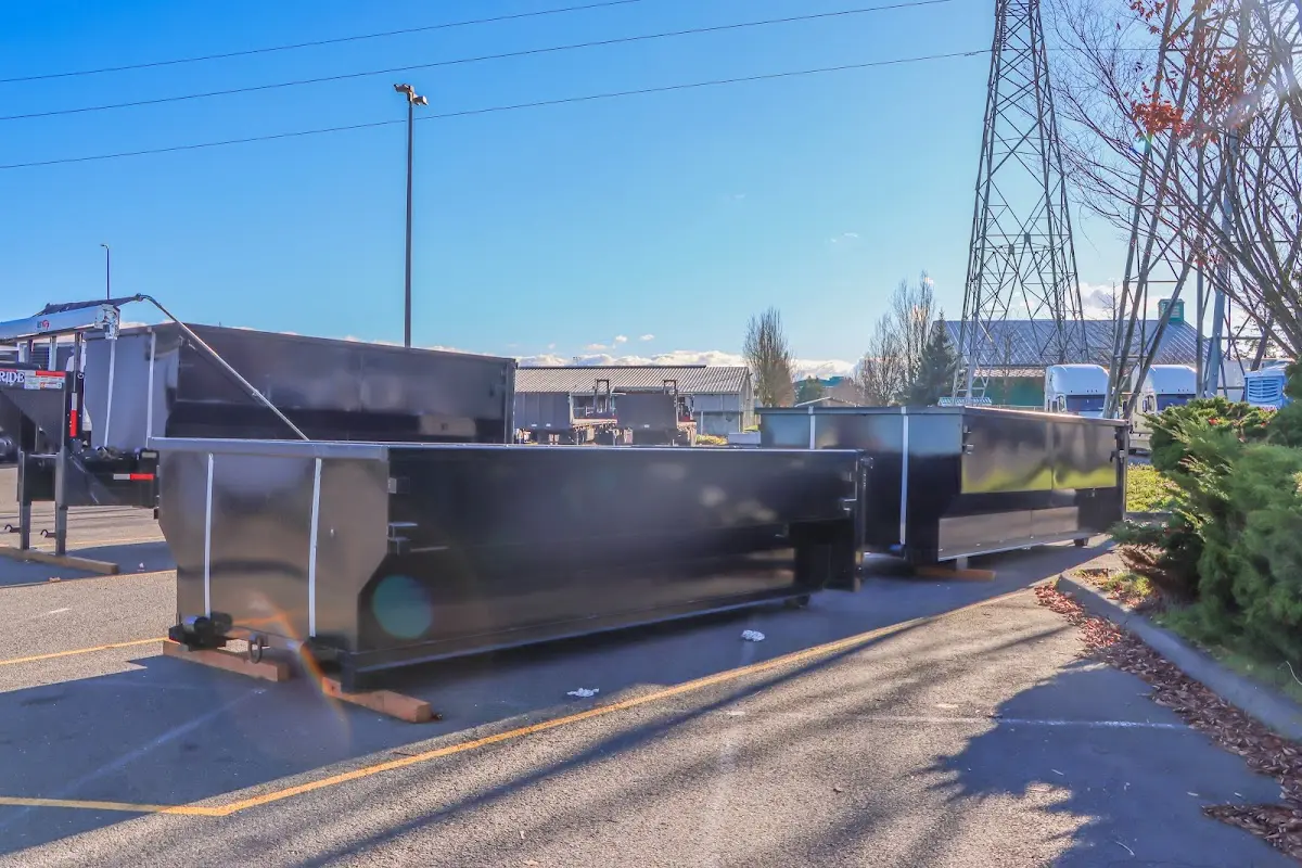 Roll-off dumpster ready for waste disposal at job site for Construction Dumpster Rental in West University Place